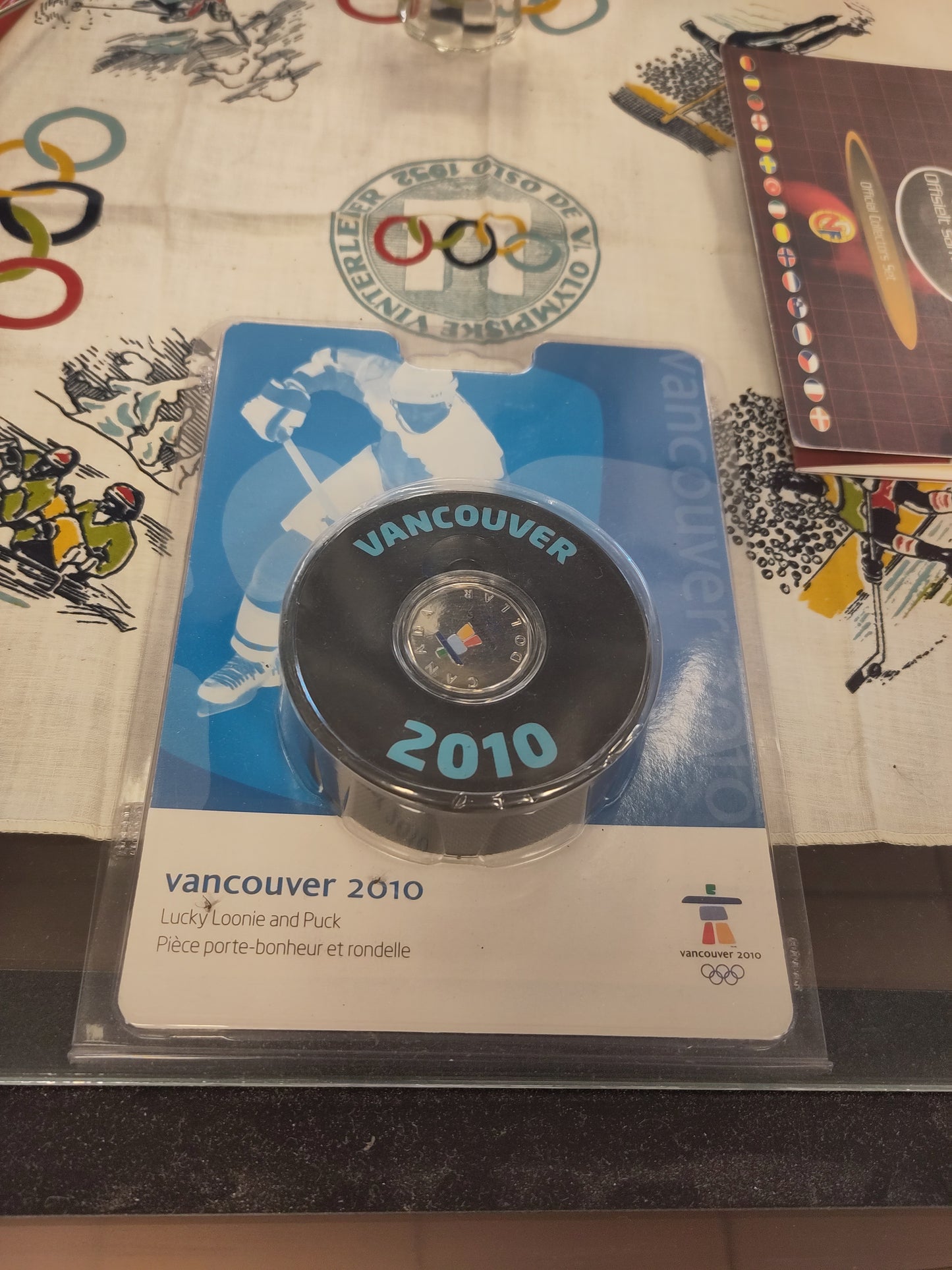 OL Vancouver 2010 puck med mynt